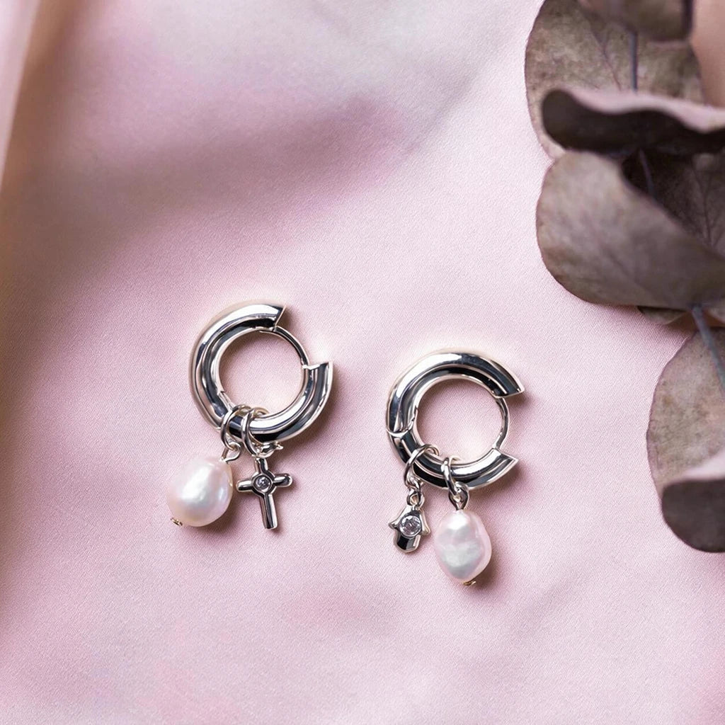 Silver-tone version of the charm hoop earrings on pink silk with baroque pearl drops